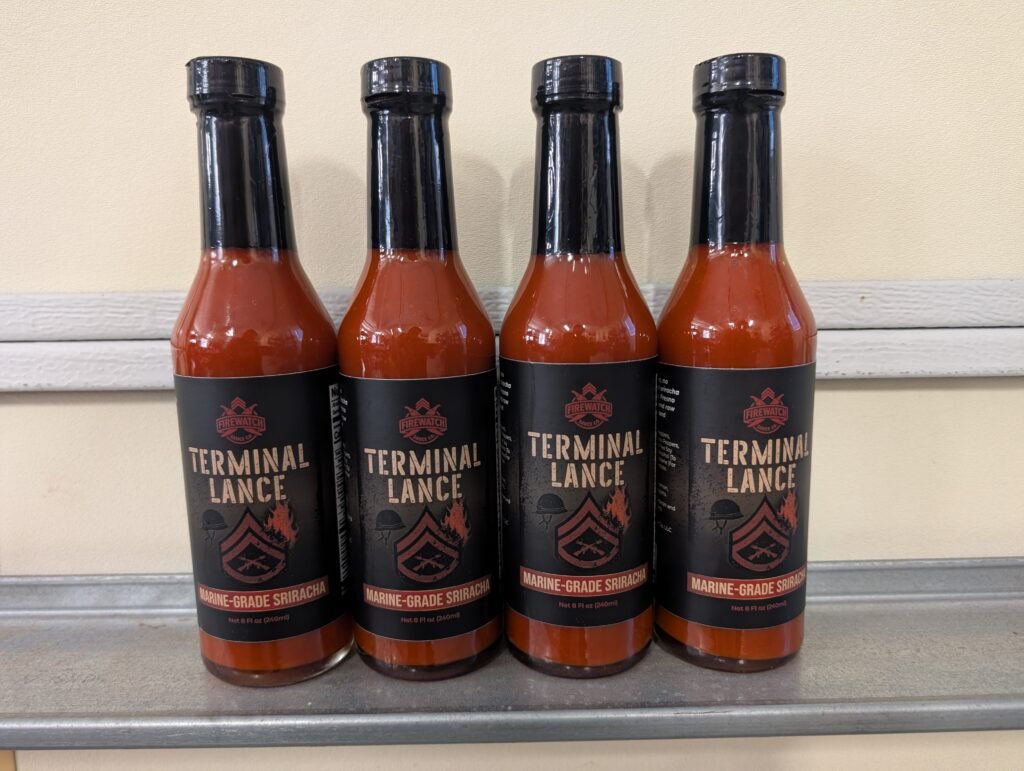 Terminal Lance hot sauce bottles by Firewatch Sauce Co